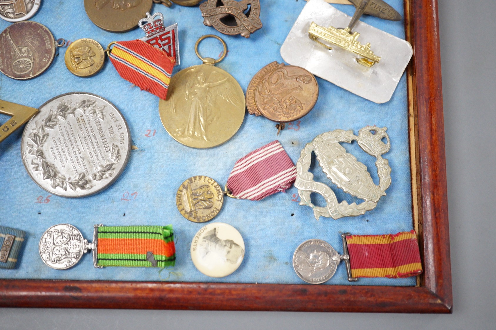 A group of WWI and WW2 and other military medals, badges and ephemera